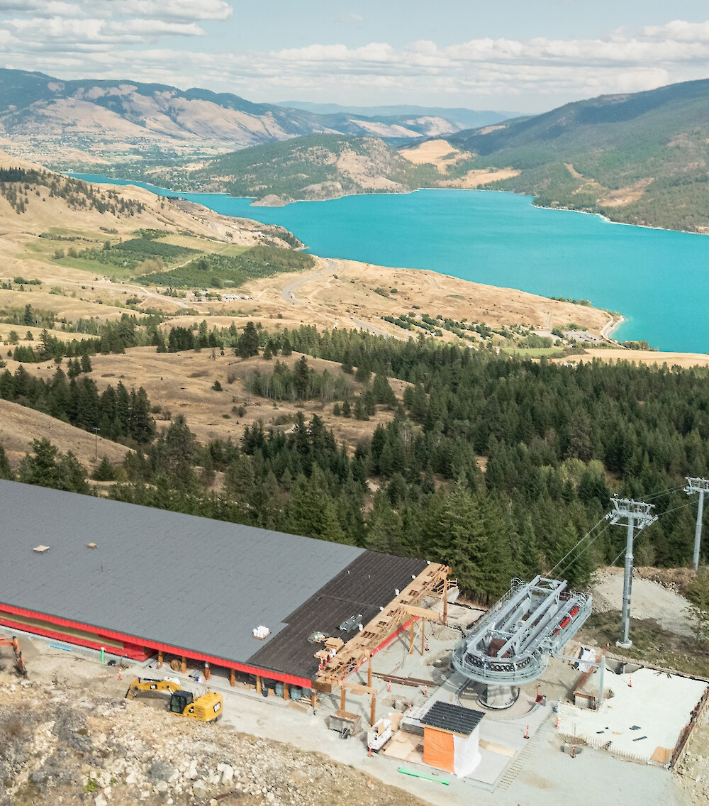 View of the Okanagan Gondola summit with Kalamalka Lake and mountains