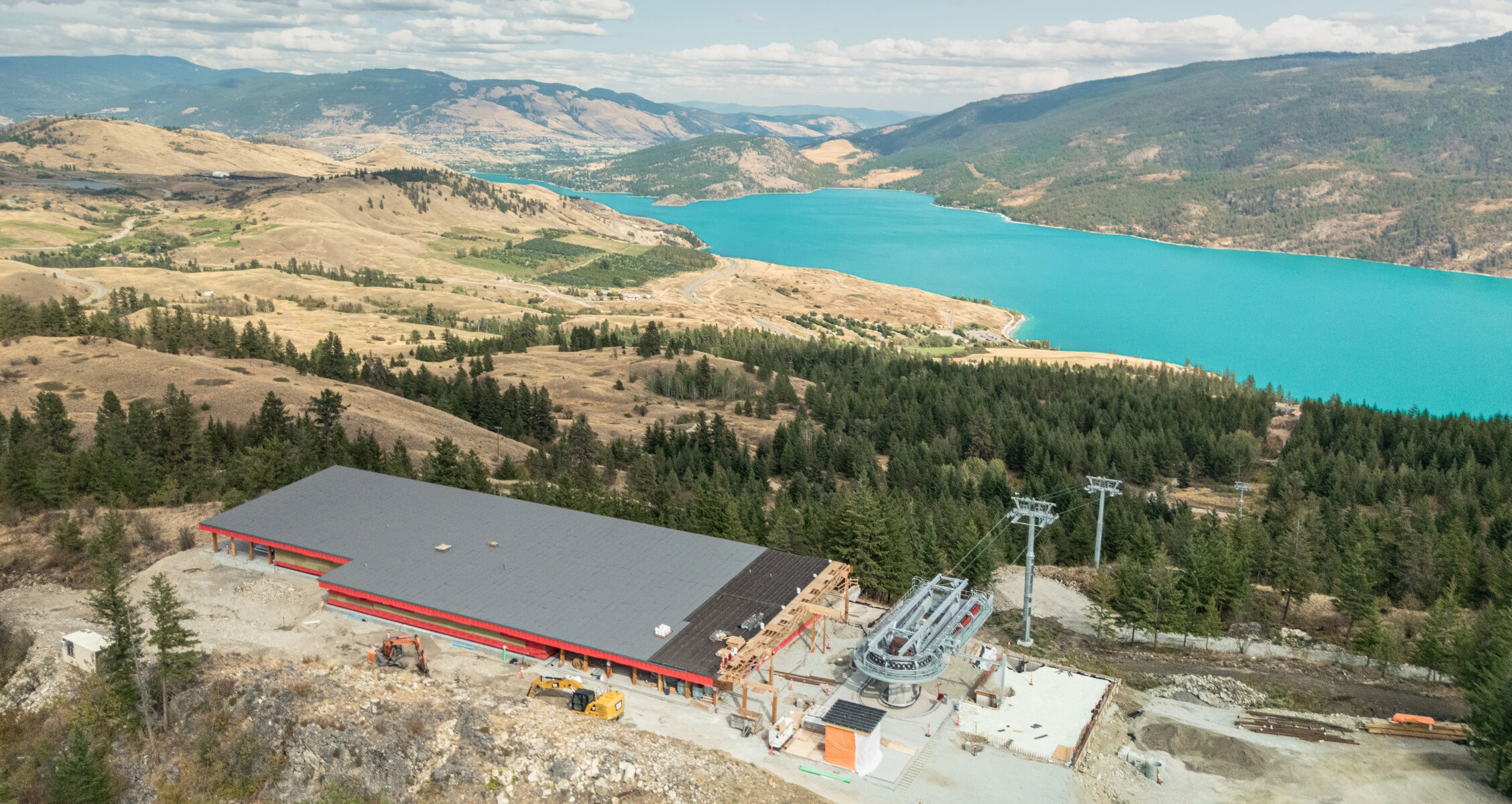 View of the Okanagan Gondola summit with Kalamalka Lake and mountains