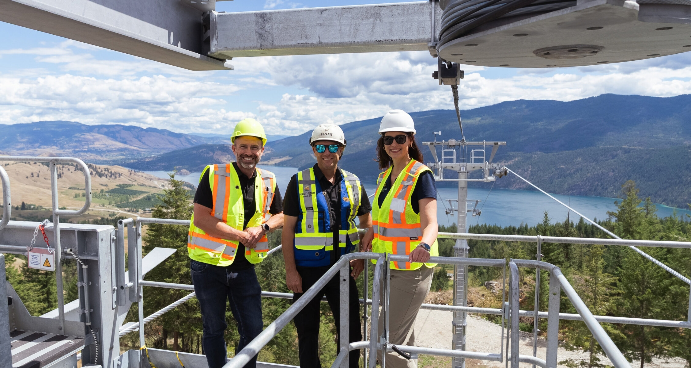 The Okanagan Gondola team stands together on the gondola terminal