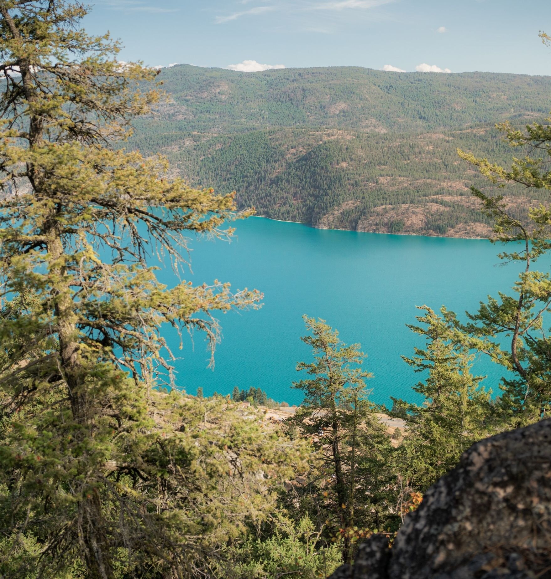 Aerial view of turquoise Kalamalka Lake from cliff lookout at Okanagan Gondola