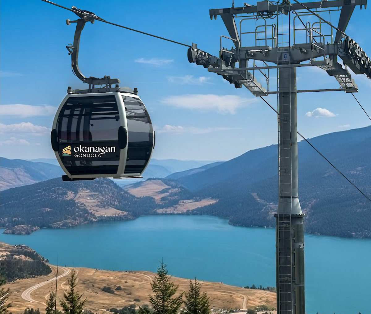 Modern CWA gondola cabin passing a steel lift tower with panoramic views of Kalamalka Lake and surrounding mountains at the Okanagan Gondola